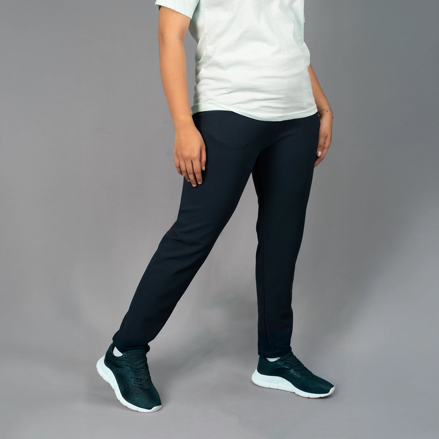 Side profile of teal blue yoga pants by Glamulous Clothing